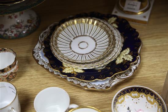 A collection of 19th century floral painted teaware and a French gilt decorated two handled vase